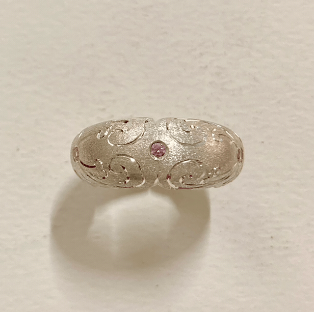 Six section silver domed ring with 6 pink cubic zirconia