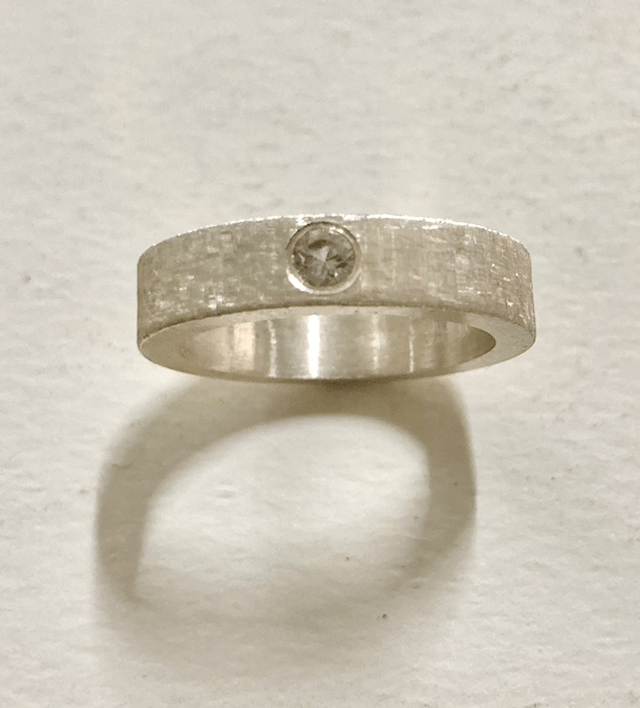 Silver band florentine engraving with white cubic zirconia
