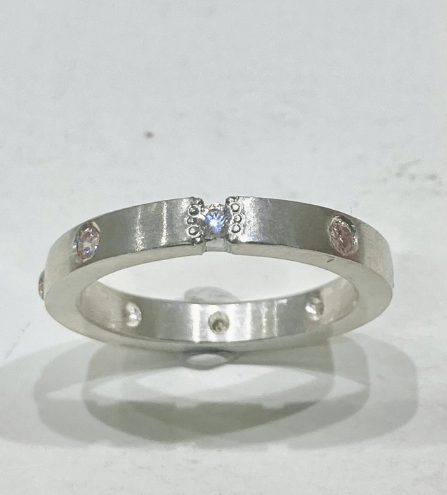 Flat band silver ring with 8 cubic zirconia 