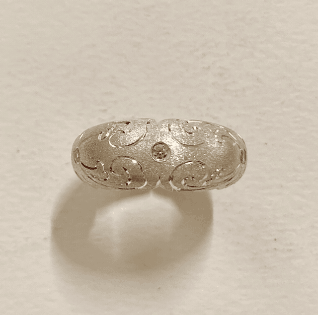 Six section silver domed ring with 6 pink cubic zirconia