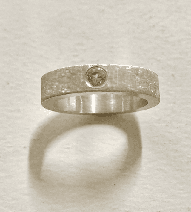Silver band florentine engraving with white cubic zirconia