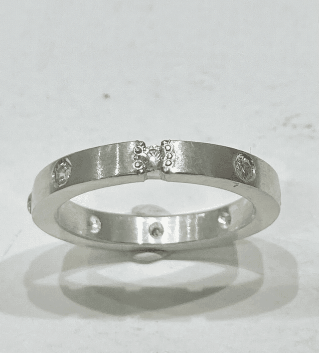 Flat band silver ring with 8 cubic zirconia 
